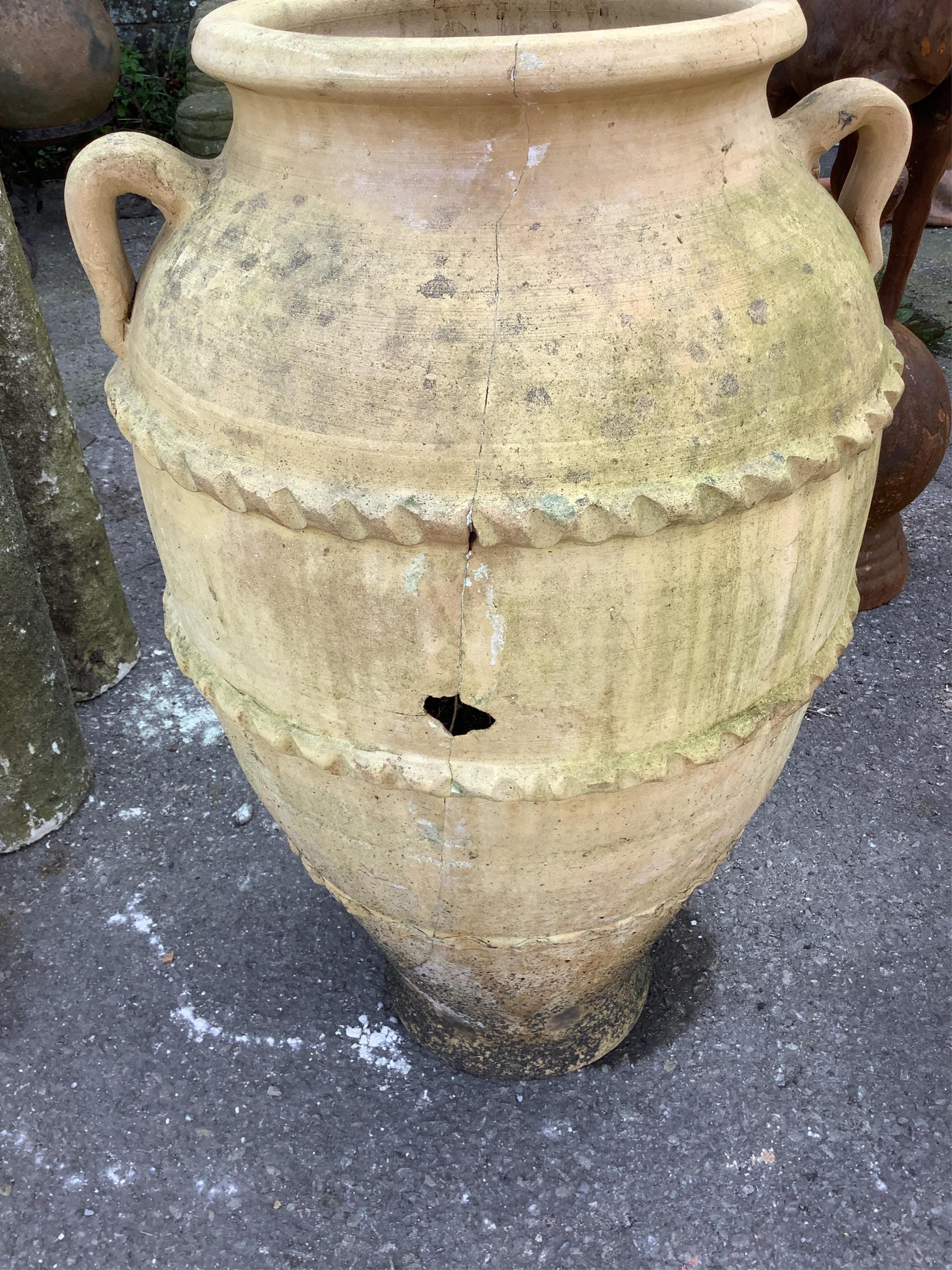 A pair of terracotta amphora style garden urns, height 68cm. Condition - weathered and one cracked